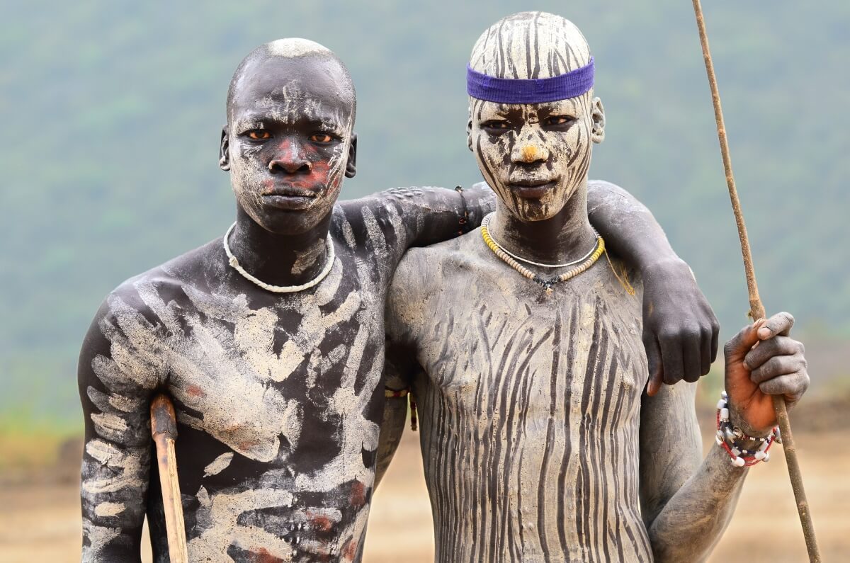 The evolution of tribal tattoos, from ancient traditions to modern tattoo artistry, depicting cultural history and contemporary design.